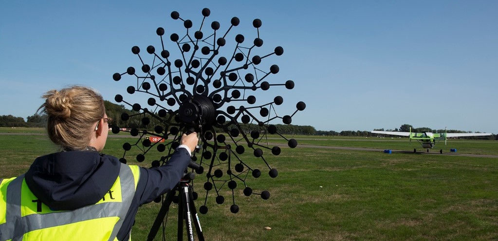 TU Delft PhD researcher taking noise measurements